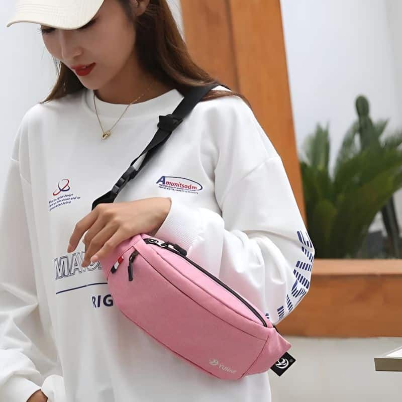 2-pocket fanny pack carried on the shoulder