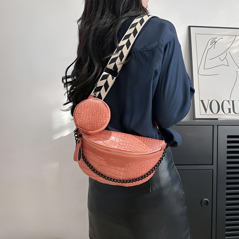 Pink women's fall fanny pack worn on the shoulder