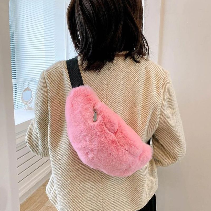 pink fur fanny pack with shoulder strap on the back