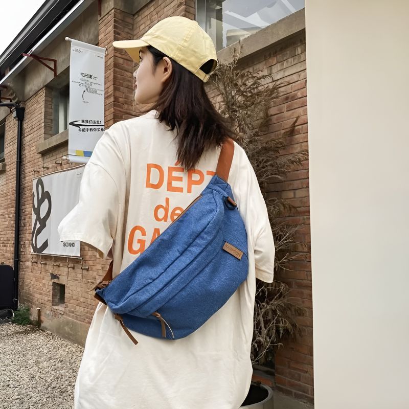 Denim fanny pack worn crossbody on the back